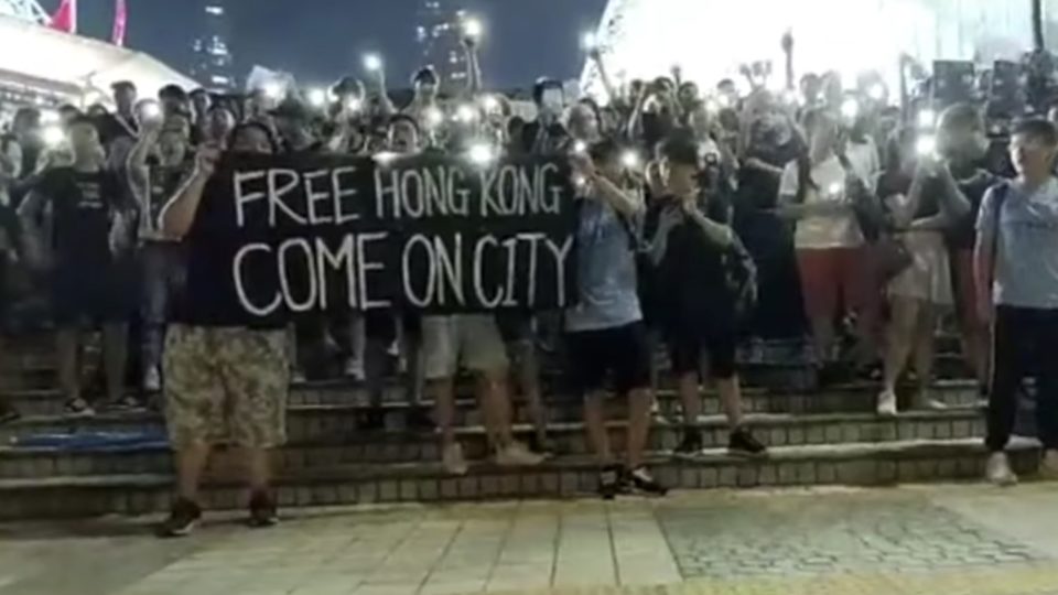 Hongkongers gather outside Hong Kong stadium after a friendly match between Manchester City and local club Kitchee. Screengrab via YouTube.