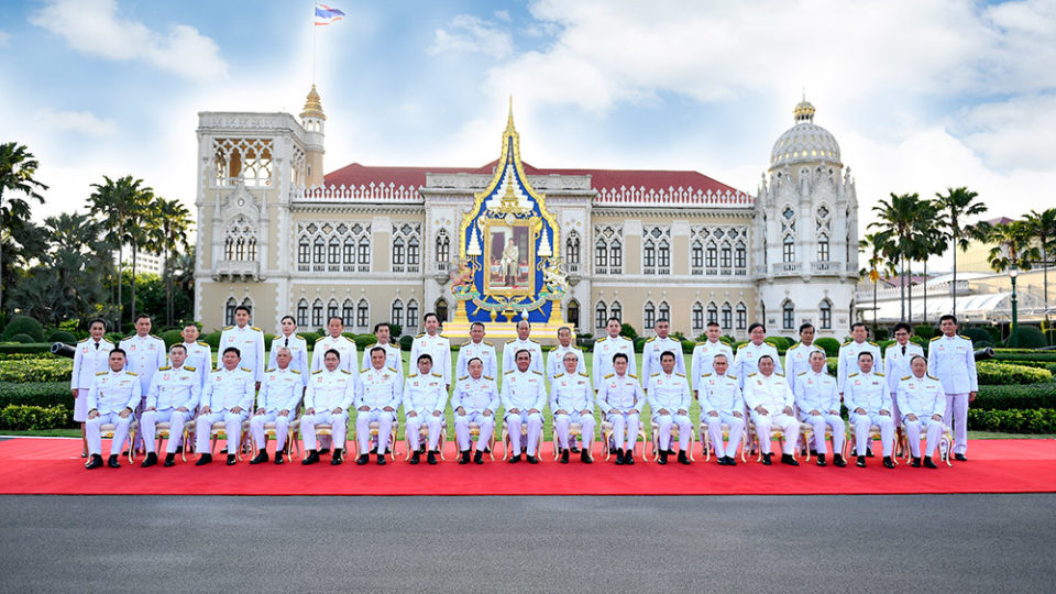 Members of the new cabinet sit for a group photo Tuesday in Bangkok.