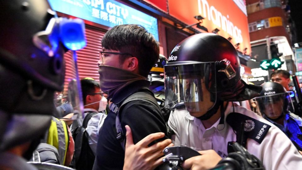 Police arrest a protester during a clash in the Mong Kok district in Kowloon after a march to the West Kowloon rail terminus against the proposed extradition bill in Hong Kong on July 7, 2019. Photo by Hector Retamal/AFP