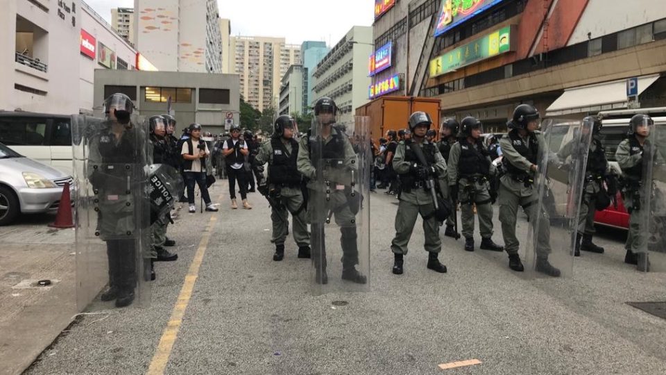 Riot police stand in formation in Sha Tin, where an anti-extradition rally took place on Sunday. Photo by Samantha Mei Topp.