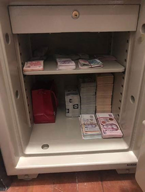 Wads of cash found during raids targeting unlawful remote gambling. (Photo: Singapore Police Force)