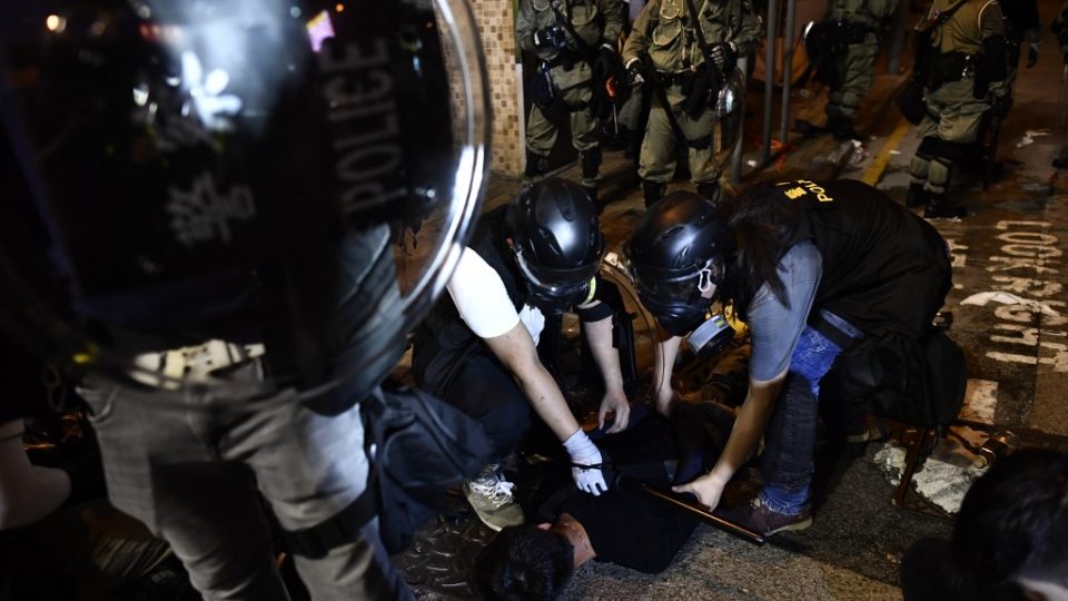 Police officers arrest a protester taking part in a demonstration against what activists say is police violence in Hong Kong on July 28, 2019. Anthony Wallace / AFP)