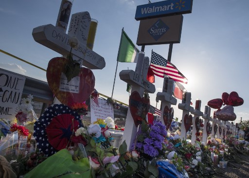 Crosses and flowers at a makeshift memorial for victims of Walmart shooting that left a total of 22 people dead at the Cielo Vista Mall WalMart in El Paso, Texas, on August 5, 2019. <i> Photo: Mark Ralston/AFP </i>