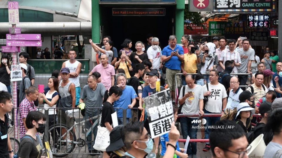 Protesters march against a controversial extradition bill in the Sham Shui Po area of Hong Kong on August 11, 2019. (Photo by Anthony WALLACE / AFP)