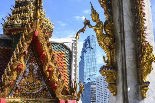 This photograph shows the Mahanakhon Tower (Pixel Tower) seen from the Wat Hua Lam Phong temple in Bangkok on August 14, 2019. Photo: Mladen ANTONOV / AFP