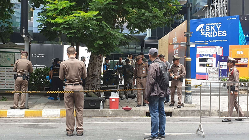 Police and EOD personnel investigate the site of a Friday morning bombing outside Bangkok’s King Power MahaNakorn Tower. Photo: Coconuts 
