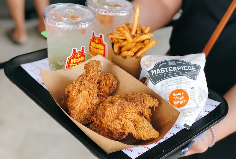 Don’t mind us, we’re just casually lusting over someone else’s fried chicken and fries at Mom’s Touch. Photo: Coconuts Media