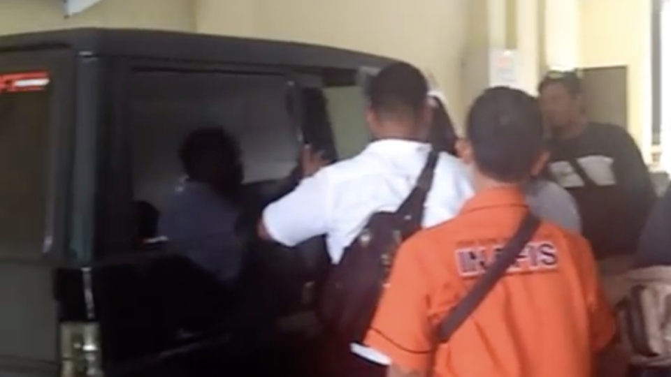 In a video uploaded by Bali Post last week, officers from the Denpasar Police appear to be examining the officer’s car from which the items were stolen. Screenshot: Bali Post / Instagram