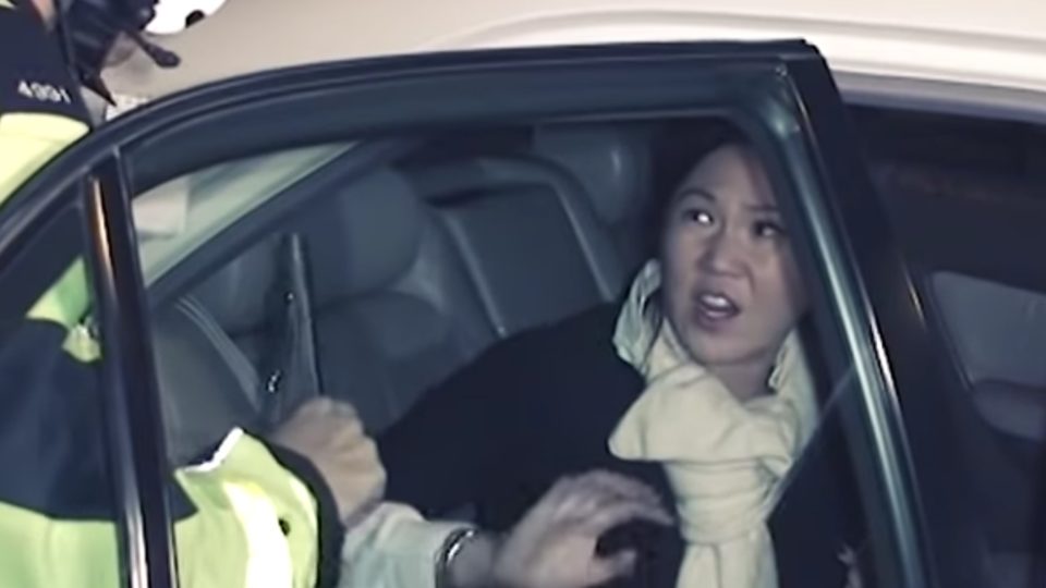 Amina Bokhary has an exchange with a police officer following an incident in 2010 in which she slapped an officer. Screengrab via YouTube.