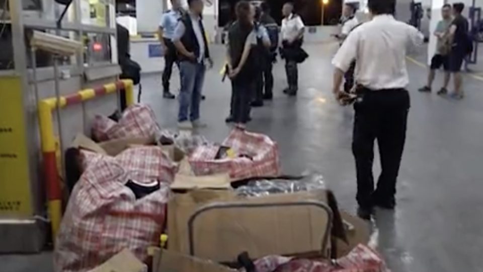 Bags containing supplies that were confiscated during a raid in an industrial building in Fo Tan. Eight people, including the founder of a banned political party advocating Hong Kong independence, were arrested. Screengrab via Apple Daily video.