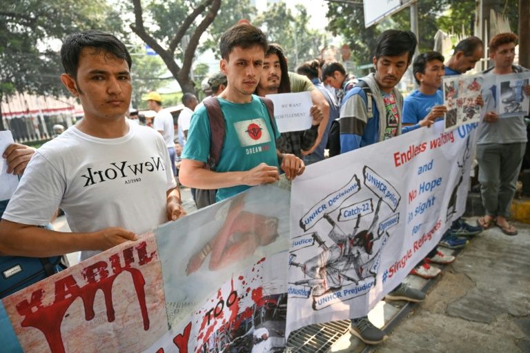 Refugees from various countries hold a rally and a hunger strike outside of UNHCR offices in Jakarta on August 20, 2019, protesting Australia’s freeze on resettlement policy. 
BAY ISMOYO / AFP