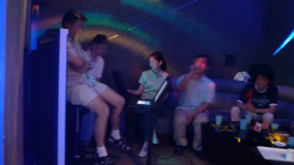 A karaoke parlor in China. Photo illustration via Flickr.