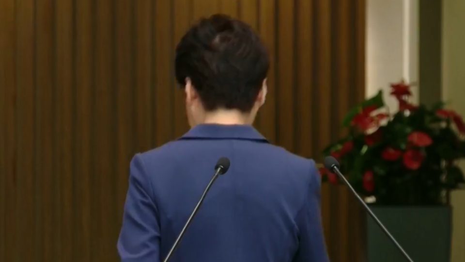 Hong Kong Chief Executive Carrie Lam leaves a heated press conference in August. Screengrab via RTHK livestream.