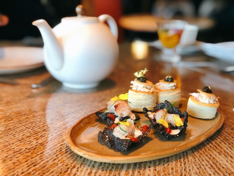 Crab pastries and hamachi cracker. Photo: Coconuts Media