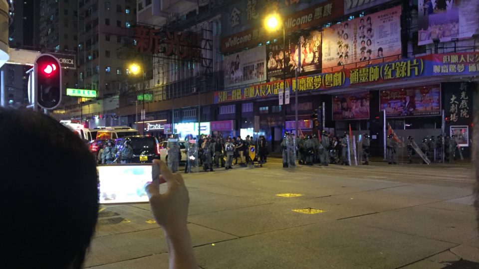 A line of riot police cordon off a section of King’s Road in North Point on Sunday night. Photo by Stuart White.