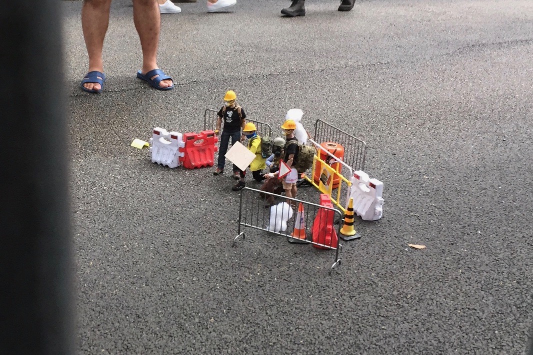 One of the tableaus of protesters created with custom figurines. Photo by Stuart White.