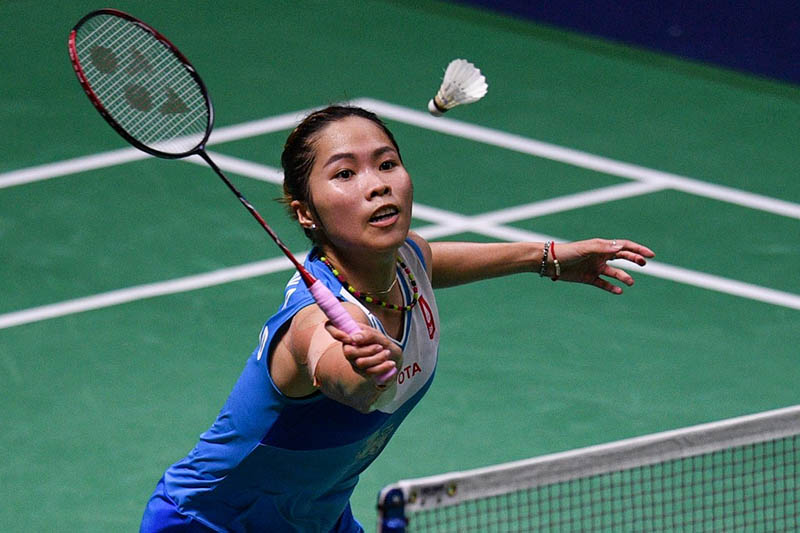 Thailand’s Ratchanok Intanon hits a shot against China’s Chen Yufei during their women’s singles final match Sunday at the Thailand Open badminton tournament in Bangkok. Photo: Chalinee Thirasupa / AFP
