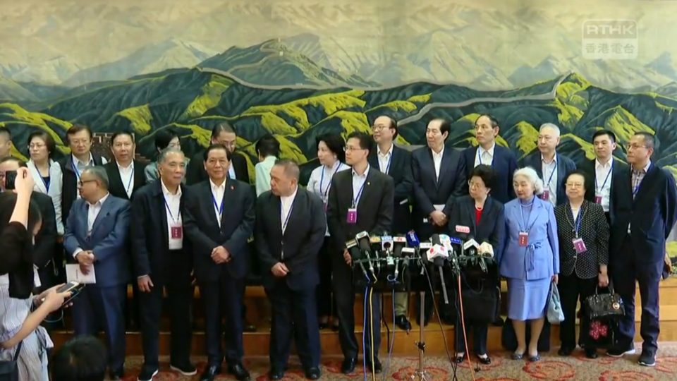 Attendees of a meeting between local pols and the head of the Hong Kong and Macau Affairs Office in Shenzhen prepare to speak to the press today. Screengrab via RTHK video.