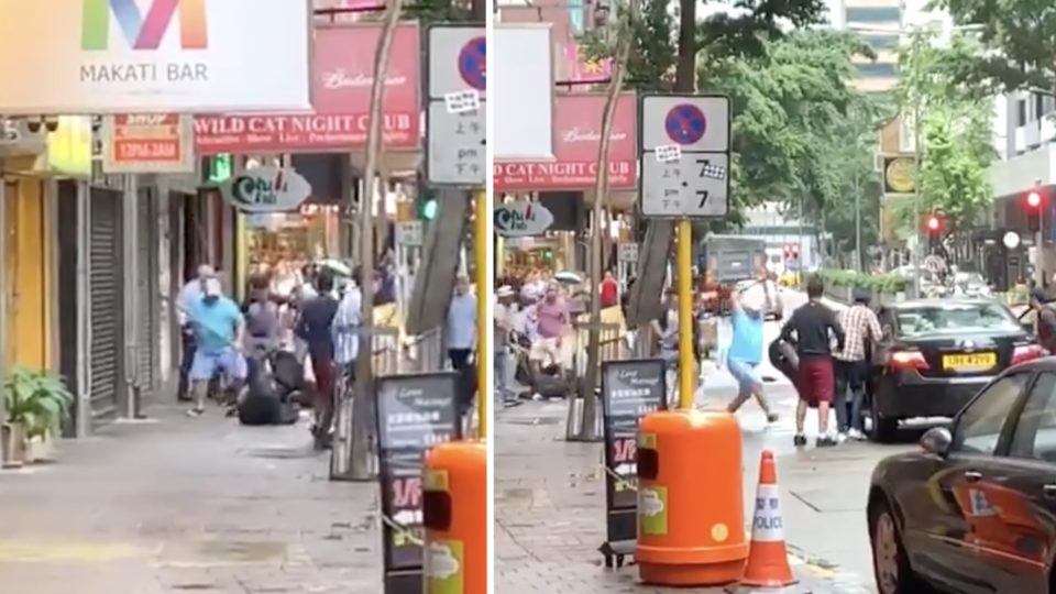 Video posted online captures the moment a group of masked men attack another group of men by beating them with sticks and hitting a nearby BMW. Screengrabs via Facebook Video.