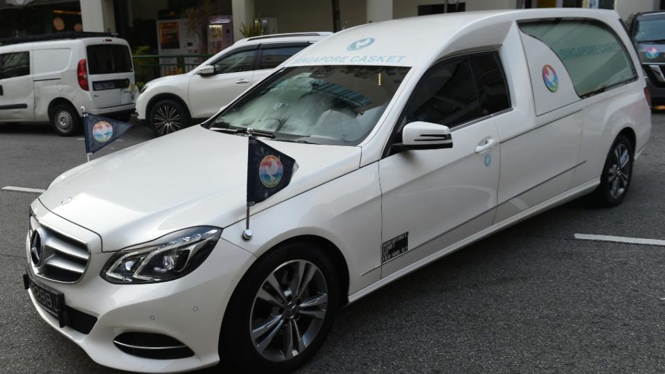 A hearse transporting the body of former Zimbabwean president Robert Mugabe leaves the Singapore Casket funeral parlour in Singapore on September 11, 2019, to head to an airport and be flown back to Zimbabwe for burial. – Mugabe, a guerrilla leader who swept to power after Zimbabwe’s independence from Britain and went on to rule for 37 years until he was ousted in 2017, died on September 6, aged 95. (Photo by ROSLAN RAHMAN / AFP)