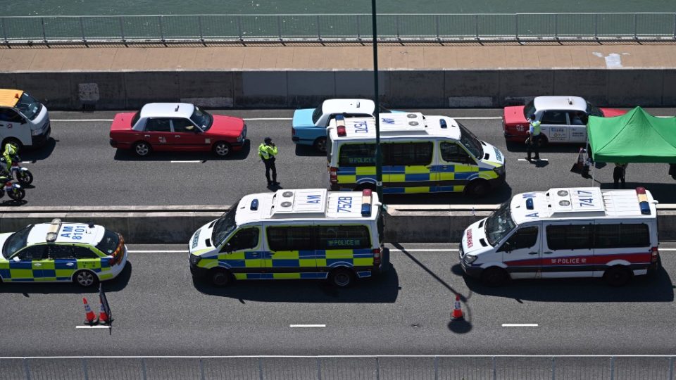 Police perform vehicle checks on a bridge near Tung Chung in Hong Kong on September 22, 2019. – Hong Kong reduced rail and bus links to the city’s airport on September 22 and police stepped up security checks in a bid to scupper plans by pro-democracy protesters to disrupt the bustling transport hub. (Photo by Anthony WALLACE / AFP)