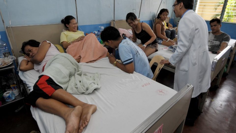 A doctor attends to patients at the San Lazaro Hospital in Manila in 2009. <i>Photo by Jay Directo/ AFP</i>