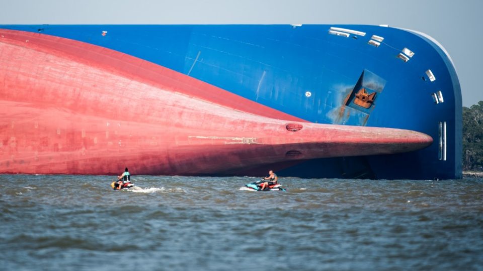 Emergency responders work to rescue crew members from a capsized cargo ship on September 9, 2019 in St Simons Island, Georgia. A 656-foot vehicle carrier, the M/V Golden Ray departed the Brunswick port on Sunday and suffered a fire on board, capsizing in St. Simons Sound. <i>Photo: Sean Rayford/Getty Images/AFP</i>