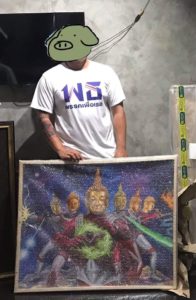 Pakorn and the painting he bought. Photo: Pakorn Porncheewarakun