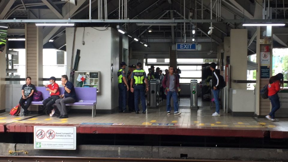 Police at the LRT-1 station after the accident. <i>Photo: Michael Delizo/ABS-CBN News</i>