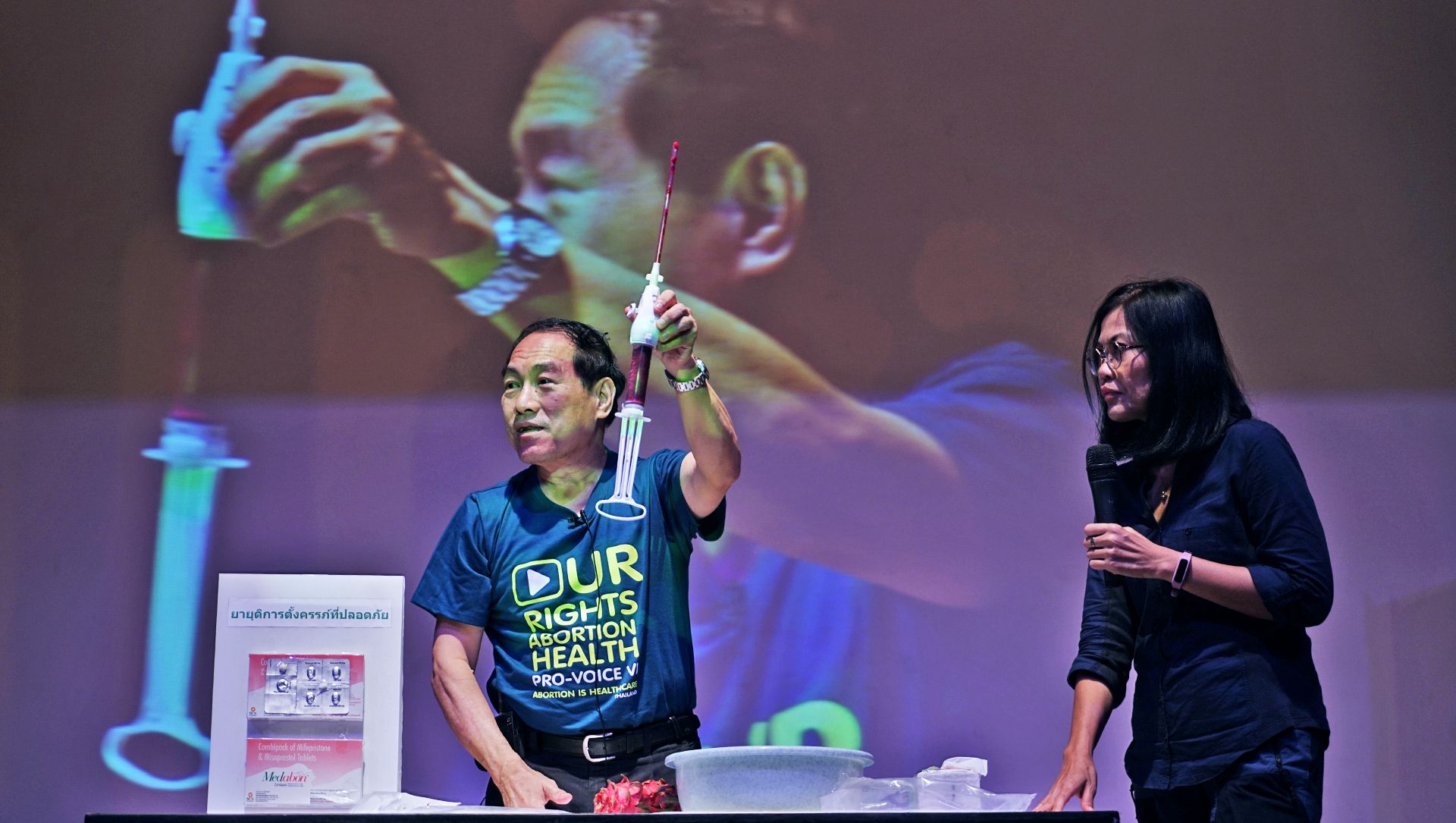 Sunya Patrachai, a Mahidol University OB/GYN professor, waves a suction tube used in vaccum-aspiration abortions. Photo: Coconuts

