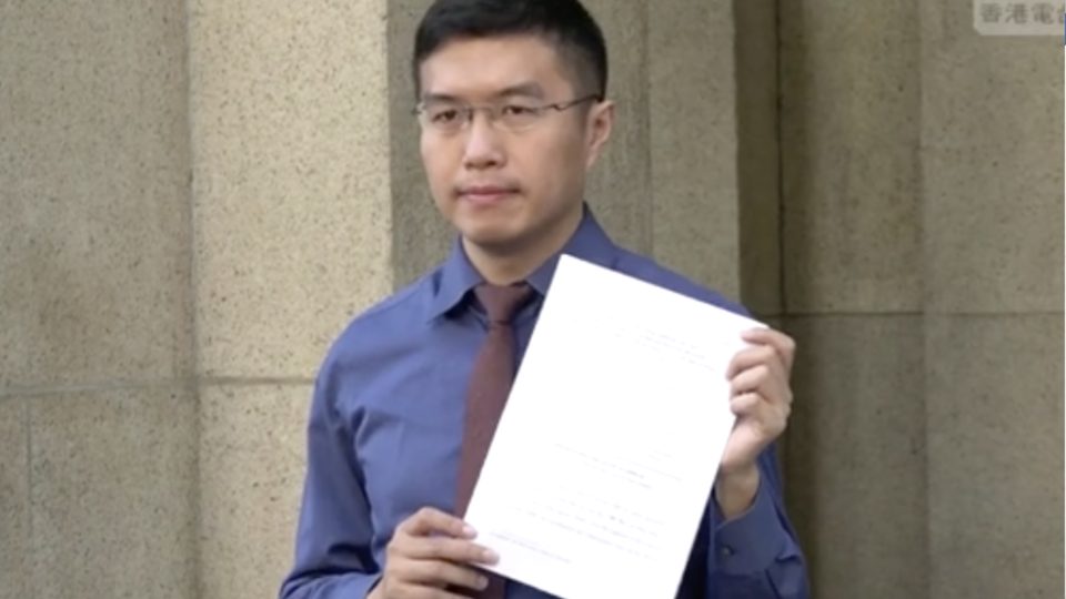 Au Nok-hin stands outside the Court of Final Appeal as he announces he will be appealing a High Court decision that ruled that the authorities were wrong to bar Agnes Chow from running in a by-election he eventually won. Screengrab  via Facebook video.