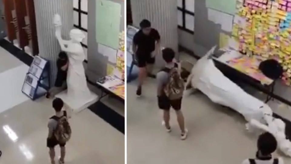 Wang Xizhao admitted to pushing over a statue of the Goddess of Democracy at City University. Screengrab via YouTube.