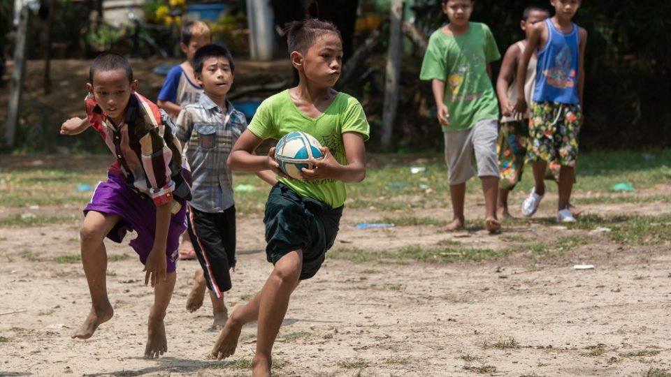 This picture taken on May 19, 2019 shows players from the Little Dragons rugby team taking part in a training session in the North Dagon township, located on the outskirts of Yangon. Photo by Sai Aung Main / AFP