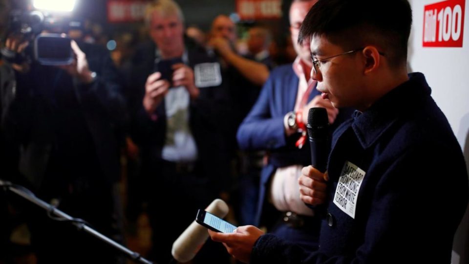 Joshua Wong speaks to the crowd at an event in Germany on Monday night. Photo via Facebook.