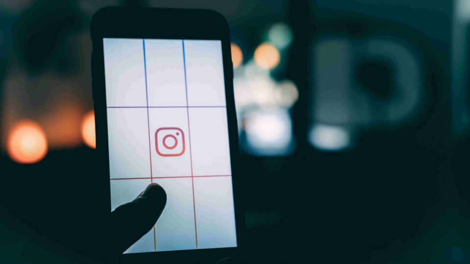 Instagram icon on a phone. Photo: Luke Van Zyl/unsplash