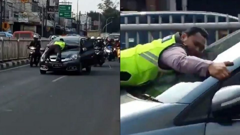 A video of a police officer who jumped onto the hood of a moving car in order to stop it for a traffic violation in Pasar Minggu, South Jakarta has recently gone viral. Screenshot from Twitter