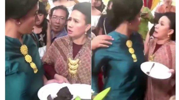 Two Indonesian ladies fighting over rendang at a wedding party. Photo: Video screengrab