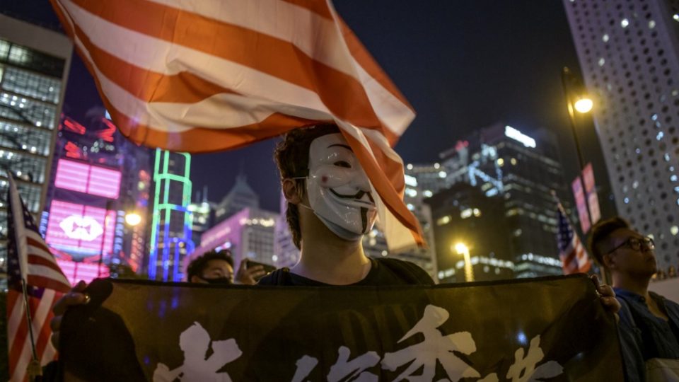 A masked man attends a prayer rally to show support for pro-democracy protesters in Hong Kong on Oct. 19, 2019. Photo via AFP.