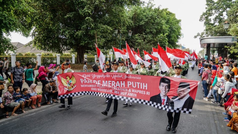 Indonesians take part in a parade to celebrate the upcoming inauguration of President Joko Widodo’s second term in Jakarta on October 19, 2019. (Photo by Oka HAMIED / AFP)