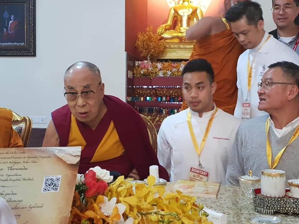 Pattarawit ‘Park’ Junthai, center right, sits beside the Dalai Lama in 2018. Photo: Pattarawit Junthai / Courtesy