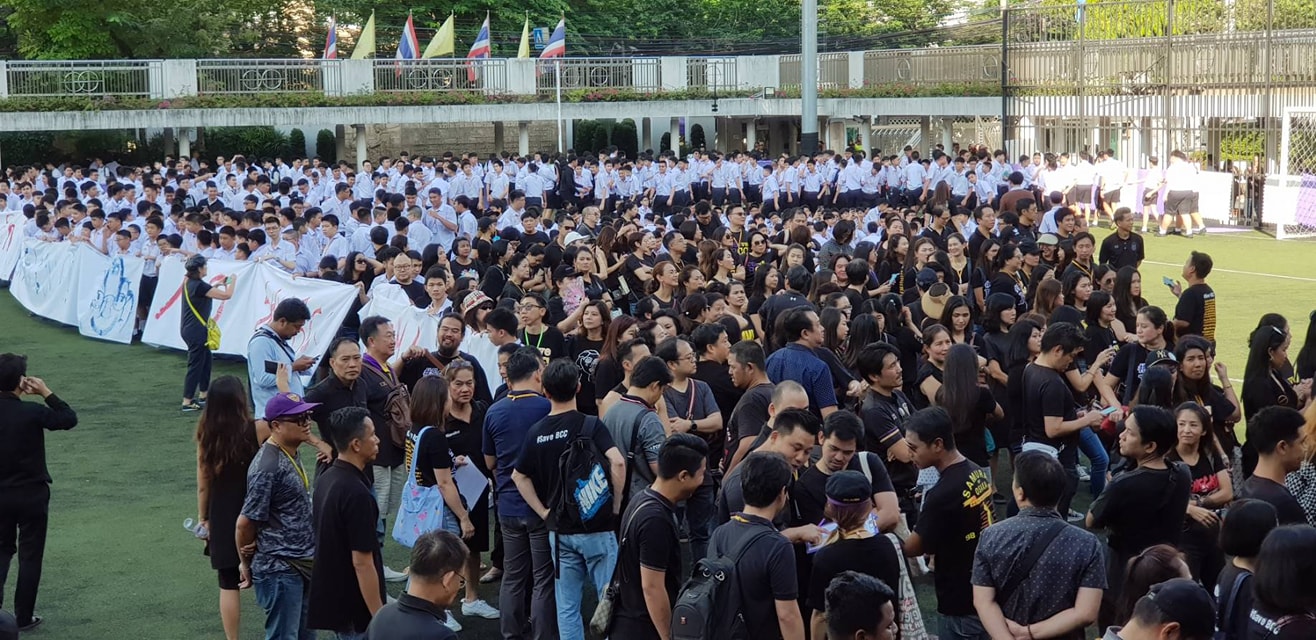 Members of the BCC community gather to protest Monday at its campus just off lower Sathorn Road. Photo: SAVEBCC / Facebook