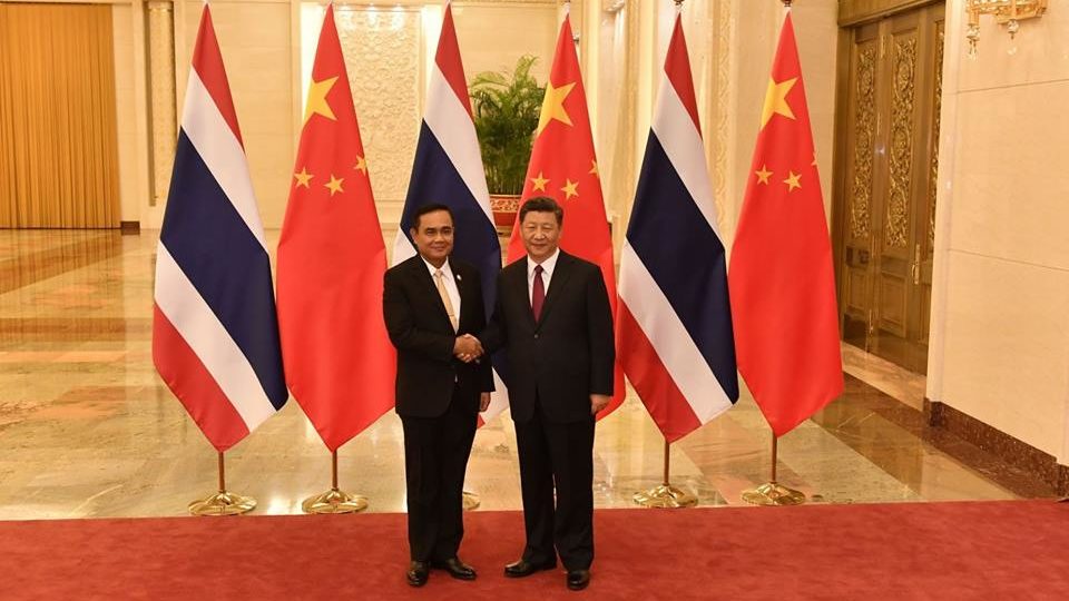 Thailand’s prime minister Gen. Prayuth Chan-ocha shakes hands with China’s president Xi Jingping. Photo: Chinese Embassy in Bangkok / FB