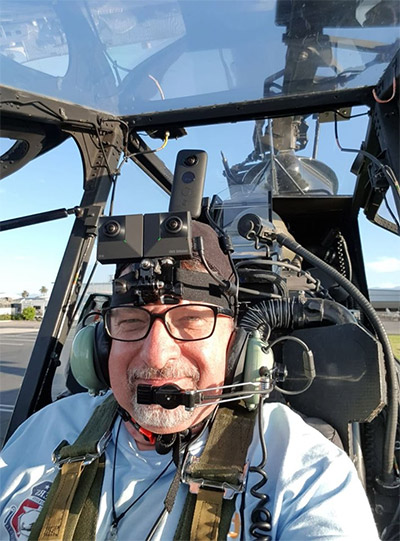 Caudullo sports his chic head-mounted rig as he's strapped inside a Bell AH-1 Cobra attack helicopter in California. Photo: Al Caudullo / Courtesy