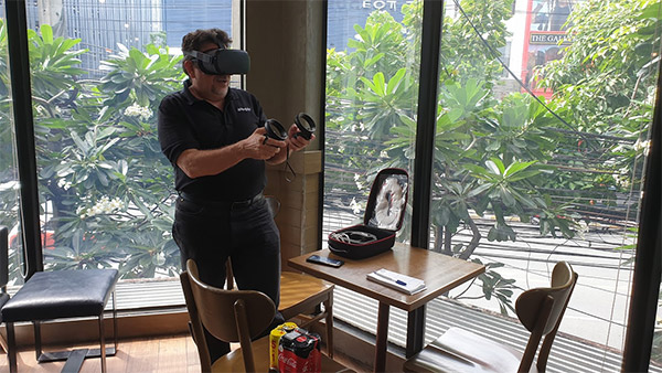 He's equipped with a portable rig ready to drop a VR demo anytime, any place, such as the upper floor of a Thonglor Starbucks. Is he even gonna buy coffee? Nah.