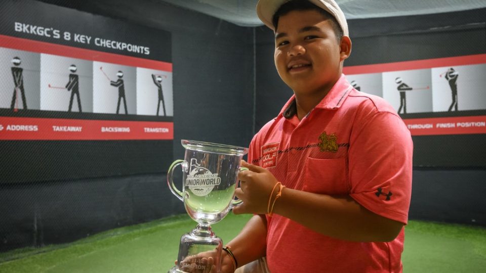 Poomrapee “Top Gun” Kaewpiboon holds his trophy on Aug. 16 after winning the IMG Academy Junior World Championship golf tournament at the Bangkok Golf Centre in Bangkok. Photo: Mladen Antonov / AFP