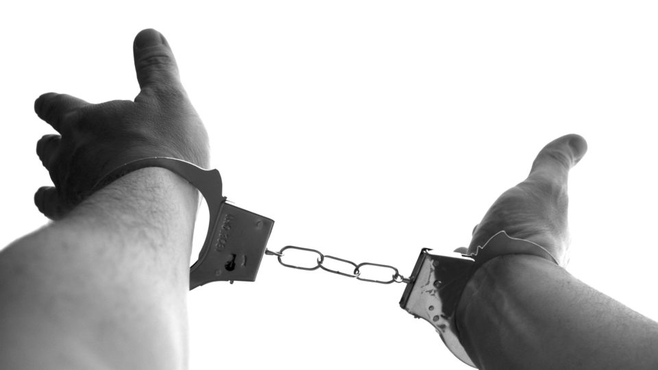 Photo illustration of a person in handcuffs. Photo: Klaus Hausmann/Pixabay