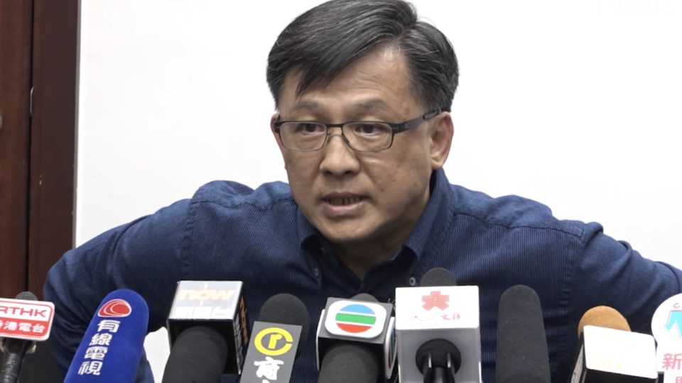 Pro-Beijing lawmaker Junius Ho at a press conference on July 22 where he denied being involved with an indiscriminate attack on pro-democracy supporters, commuters and journalists at Yuen Long MTR station on July 21, 2019. Screengrab via YouTube.