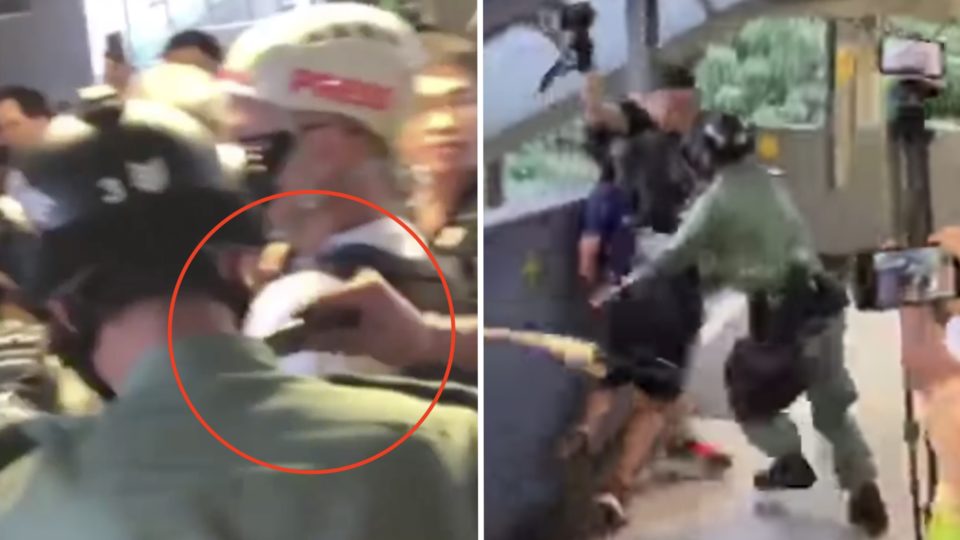 The moment someone uses ‘a sharp object’ to cut the neck of a police officer outside Kwun Tong MTR station. Screengrab via Facebook video/Ming Pao and YouTube.