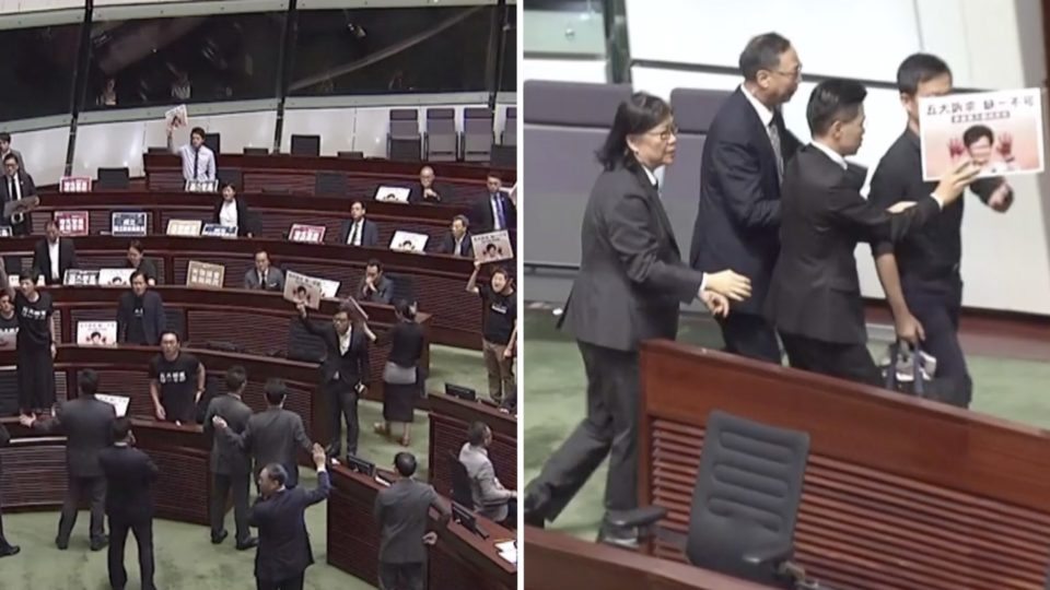 Pro-democracy lawmakers disrupt opening of Carrie Lam’s policy address (left), lawmaker Ray Chan is escorted from the chamber (right). Screengrab via Facebook video/Now News.