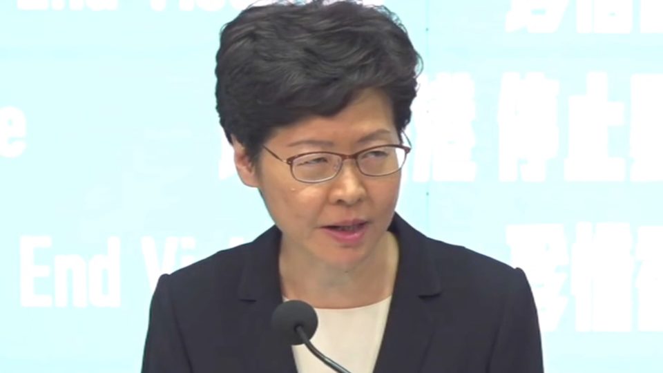 Chief Executive Carrie Lam announces the implementation of a controversial ban on face masks aimed at clamping down on protests at a press conference today. Screengrab via Facebook/HK01.